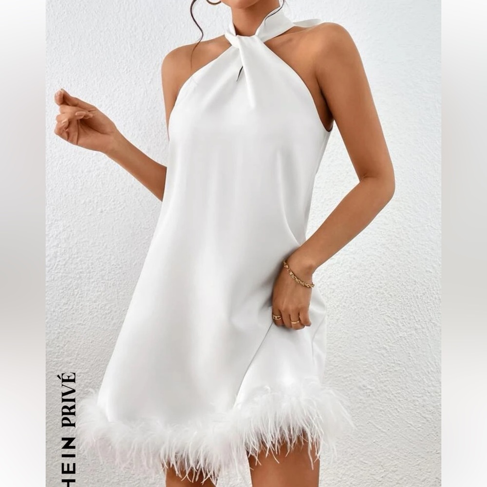 XS White halter top dress with feathers.